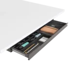 Close up of the key lock on the black steel drawer for secure office storage.