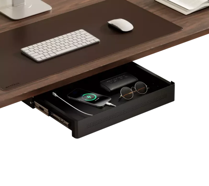 Compact pull out tray holding a phone, sunglasses, and wallet under a wooden desk.