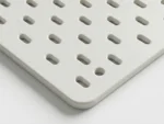 Close up view of Furnotix white modular pegboard panel 19x20 inches with vertical slots.