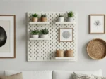 Decorative pegboard with shelves displaying succulents and picture frames.